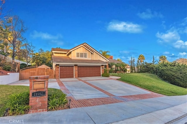 25641 Rapid Falls Rd, Laguna Hills, CA 92653 - view of front of home featuring driveway, a gate, and an attached garage