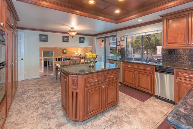 25641 Rapid Falls Rd, Laguna Hills, CA 92653 - kitchen featuring crown molding, brown cabinetry, a raised ceiling, decorative backsplash, and recessed lighting
