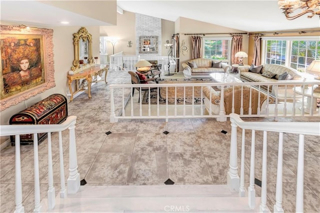 25641 Rapid Falls Rd, Laguna Hills, CA 92653 - living area featuring lofted ceiling, tile patterned flooring, and a chandelier