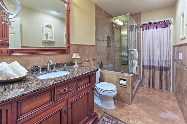 25641 Rapid Falls Rd, Laguna Hills, CA 92653 - full bath featuring a stall shower, tile walls, vanity, toilet, and a wainscoted wall