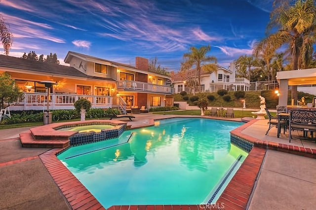 25641 Rapid Falls Rd, Laguna Hills, CA 92653 - view of swimming pool with a patio, a pool with connected hot tub, and stairs