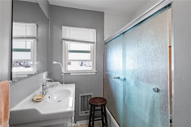 221 40th St, Manhattan Beach, CA 90266 - bathroom featuring visible vents, vanity, and a shower with door