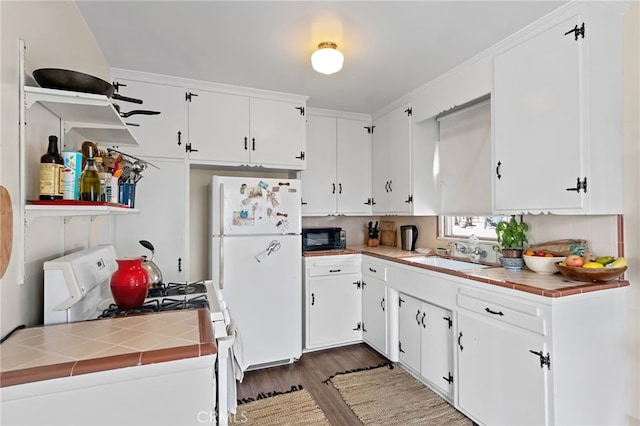 221 40th St, Manhattan Beach, CA 90266 - kitchen featuring tile countertops, dark wood-type flooring, a sink, and white appliances