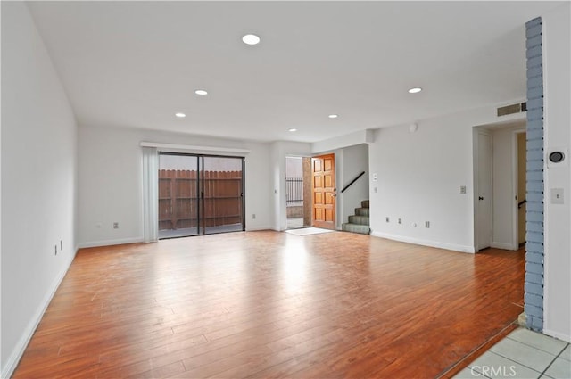 21900 Roscoe Blvd Unit 5, Canoga Park, CA 91304 - spare room with recessed lighting, stairway, visible vents, baseboards, and light wood-style flooring