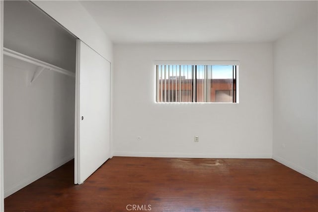 21900 Roscoe Blvd Unit 5, Canoga Park, CA 91304 - unfurnished bedroom featuring baseboards, wood finished floors, and a closet