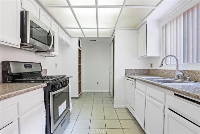 21900 Roscoe Blvd Unit 5, Canoga Park, CA 91304 - kitchen featuring light tile patterned flooring, white cabinets, stainless steel appliances, and a sink