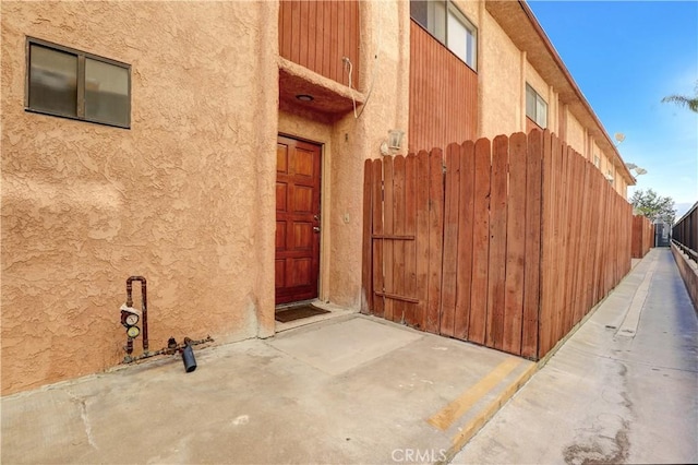 21900 Roscoe Blvd Unit 5, Canoga Park, CA 91304 - entrance to property featuring stucco siding and fence