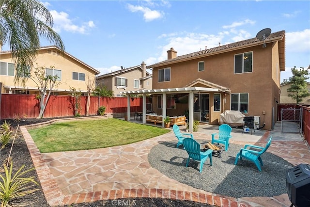 rear view of house with a fenced backyard, a pergola, a patio area, a lawn, and stucco siding