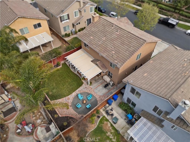 birds eye view of property with a residential view