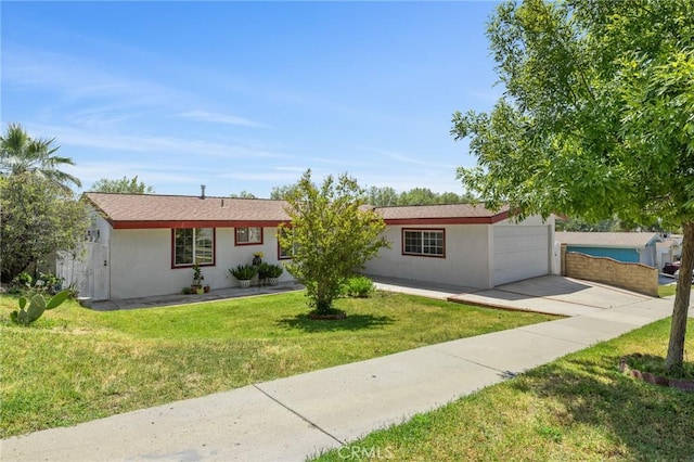 ranch-style home with an attached garage, driveway, a front yard, and stucco siding