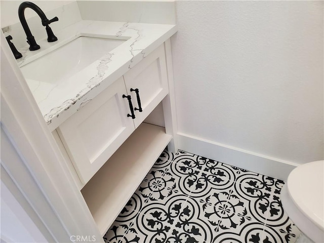 details with baseboards and vanity