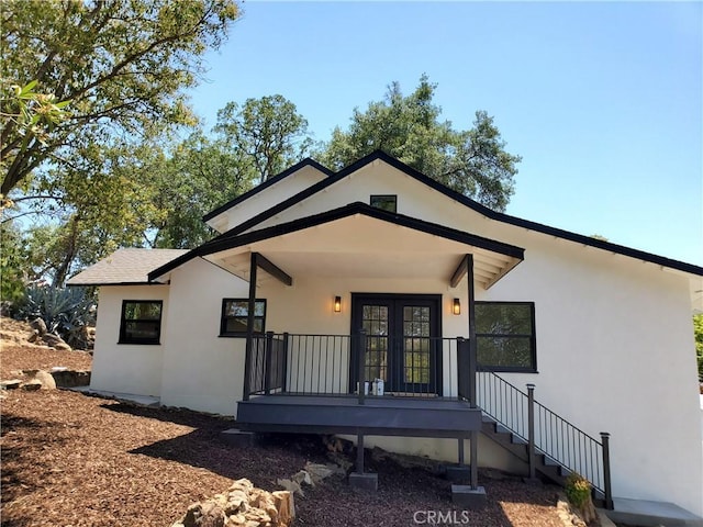 view of front of house featuring french doors and stucco siding