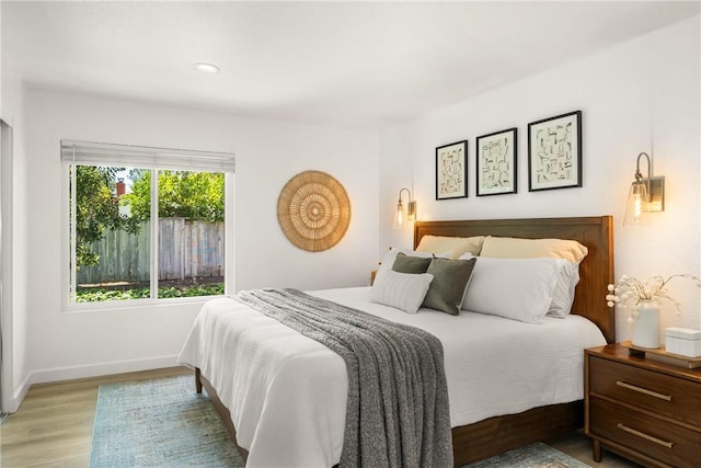 23732 Hillhurst Dr Unit 32, Laguna Niguel, CA 92677 - bedroom with recessed lighting, wood finished floors, and baseboards
