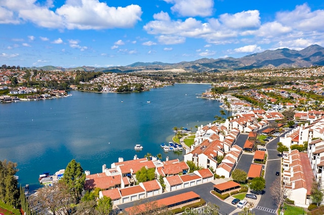 bird's eye view with a water and mountain view and a residential view