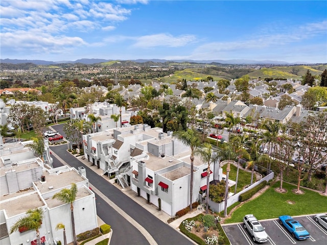 birds eye view of property featuring a mountain view and a residential view