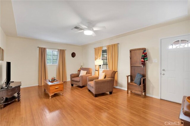 312 W Lugonia Ave, Redlands, CA 92374 - living room featuring light wood-style floors, ceiling fan, and baseboards