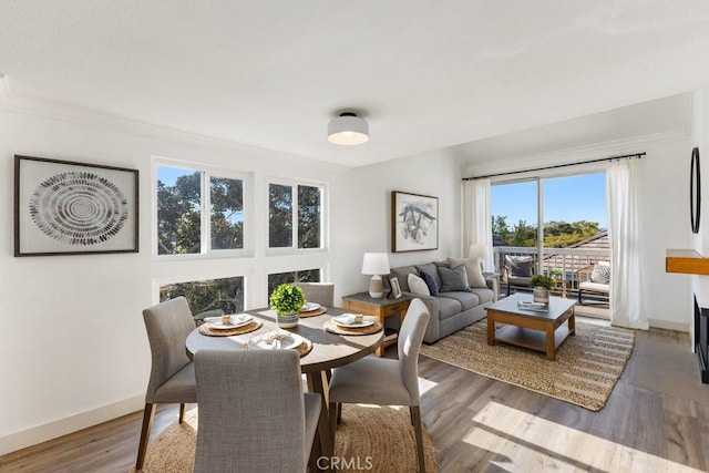 20371 Bluffside Cir Unit B401, Huntington Beach, CA 92646 - dining space featuring wood finished floors, baseboards, and ornamental molding