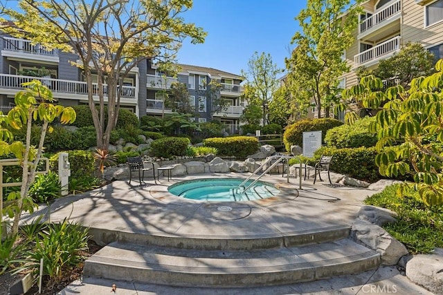 20371 Bluffside Cir Unit B401, Huntington Beach, CA 92646 - view of pool with a hot tub