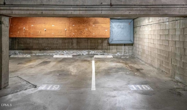 unfinished below grade area with concrete block wall