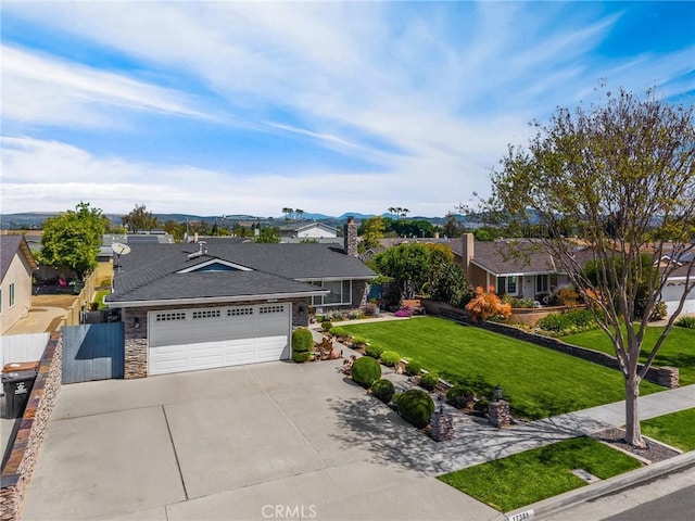 17381 Yorkshire Ave, Yorba Linda, CA 92886 - ranch-style house with a front lawn, a garage, a residential view, stone siding, and concrete driveway