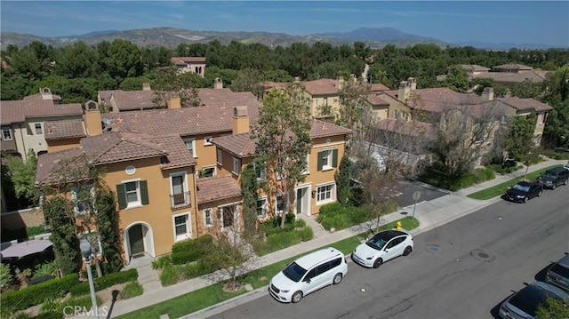 bird's eye view featuring a mountain view and a residential view