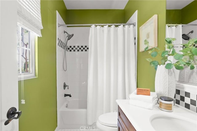 full bathroom featuring toilet, vanity, and shower / bath combination with curtain