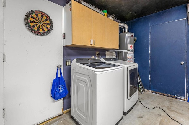 clothes washing area with cabinet space, water heater, and washing machine and clothes dryer