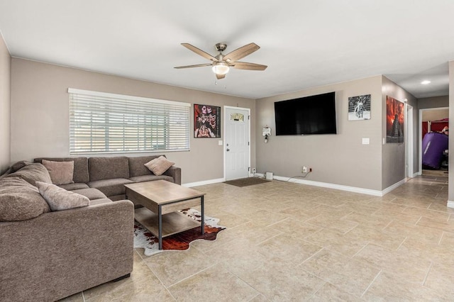 living area with baseboards, recessed lighting, and ceiling fan