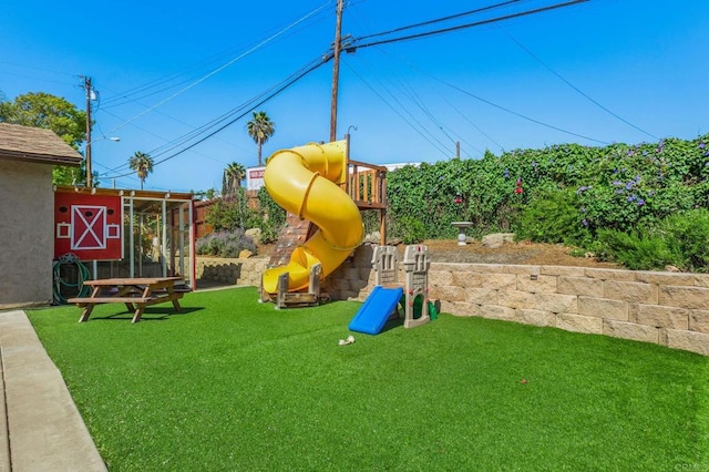 view of play area featuring a lawn