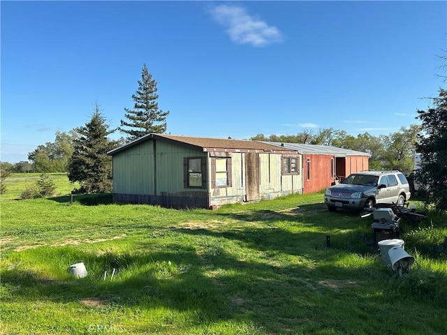 23271 Olive Ave, Gerber, CA 96035 - view of side of home featuring a lawn
