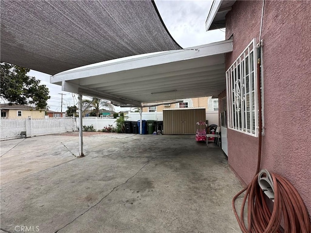 323 E 107th St, Los Angeles, CA 90003 - view of parking / parking lot with a shed and fence