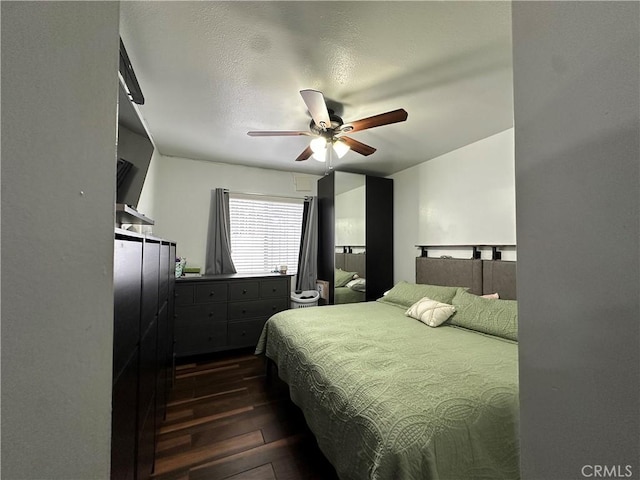323 E 107th St, Los Angeles, CA 90003 - bedroom with ceiling fan and dark wood-style flooring