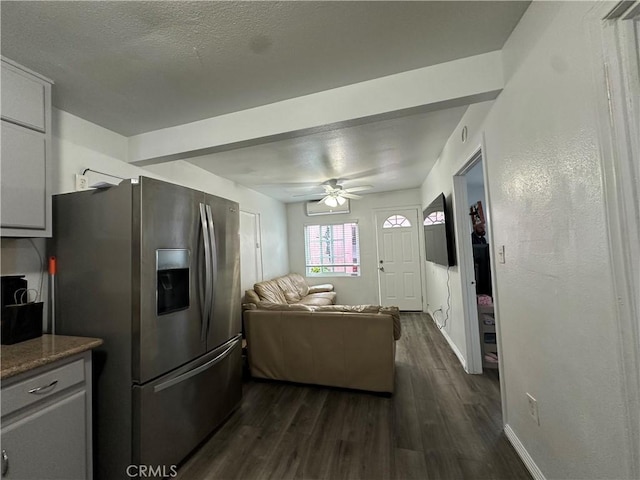 323 E 107th St, Los Angeles, CA 90003 - living room with ceiling fan, baseboards, a textured ceiling, and dark wood-style floors