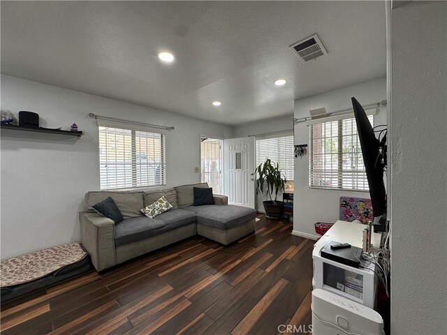 323 E 107th St, Los Angeles, CA 90003 - living area featuring a wealth of natural light, visible vents, recessed lighting, and dark wood-style floors