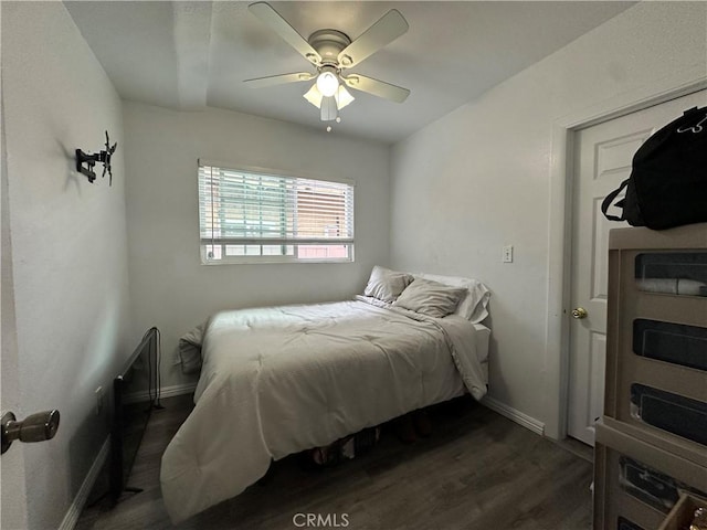 323 E 107th St, Los Angeles, CA 90003 - bedroom with dark wood-type flooring, a ceiling fan, and baseboards