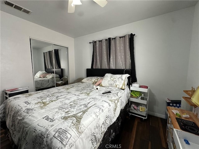 323 E 107th St, Los Angeles, CA 90003 - bedroom featuring visible vents, a closet, dark wood-style flooring, baseboards, and ceiling fan