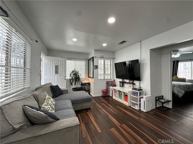 323 E 107th St, Los Angeles, CA 90003 - living room with dark wood finished floors, baseboards, visible vents, recessed lighting, and a ceiling fan