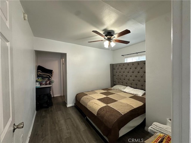 323 E 107th St, Los Angeles, CA 90003 - bedroom with baseboards, ceiling fan, and dark wood finished floors