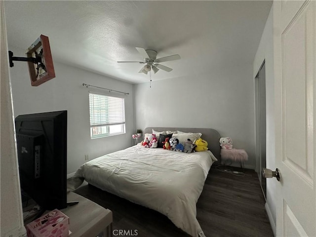 323 E 107th St, Los Angeles, CA 90003 - bedroom with wood finished floors, baseboards, and ceiling fan