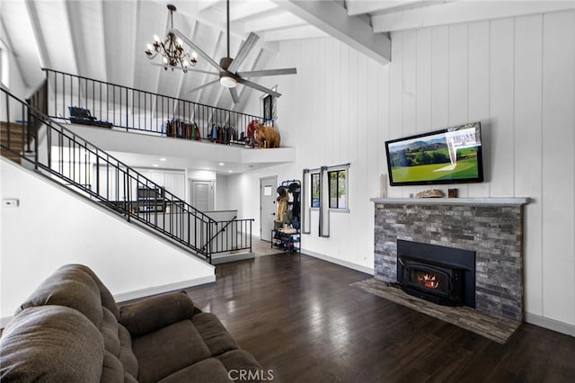 living area with stairway, beam ceiling, high vaulted ceiling, wood finished floors, and ceiling fan with notable chandelier