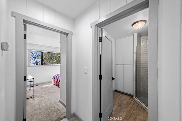 hallway featuring baseboards