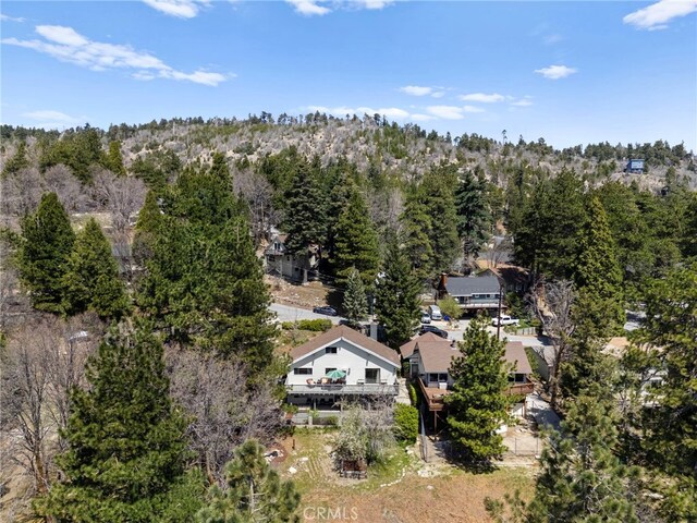 aerial view featuring a wooded view