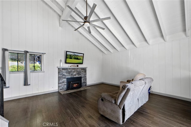 living room featuring wooden walls, a stone fireplace, lofted ceiling with beams, hardwood / wood-style flooring, and ceiling fan
