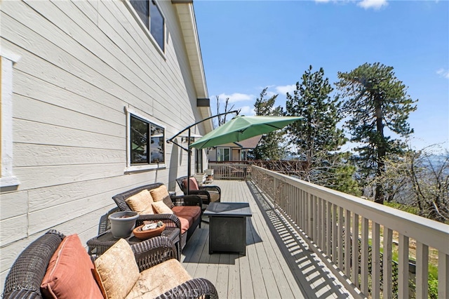 wooden deck with outdoor lounge area