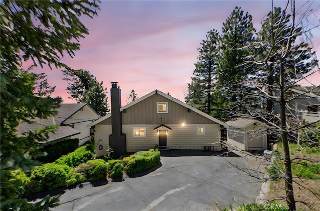 26429 Apache Trl, Rimforest, CA 92378 - view of front of home with a chimney and board and batten siding
