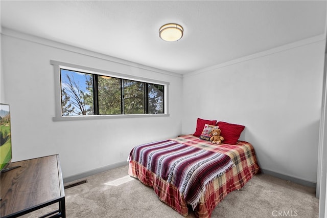 bedroom with baseboards and carpet floors