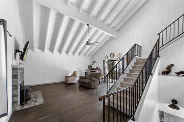 26429 Apache Trl, Rimforest, CA 92378 - living area featuring wood finished floors, stairway, wooden walls, and ceiling fan