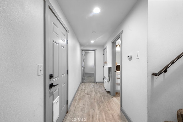 corridor featuring stairway, recessed lighting, light wood finished floors, and baseboards