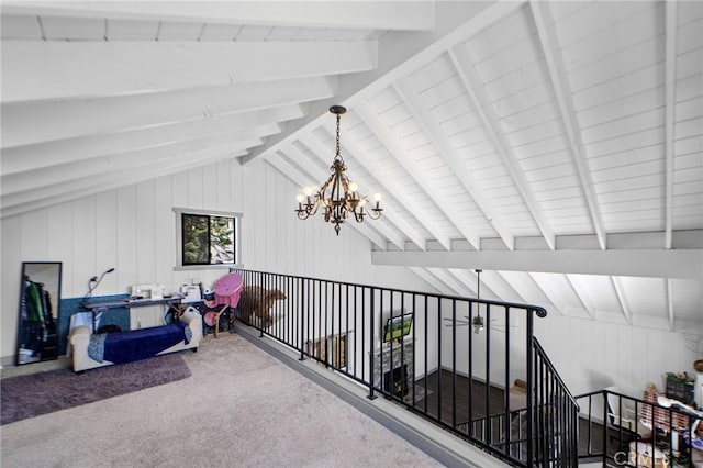 additional living space with carpet, a notable chandelier, and vaulted ceiling with beams