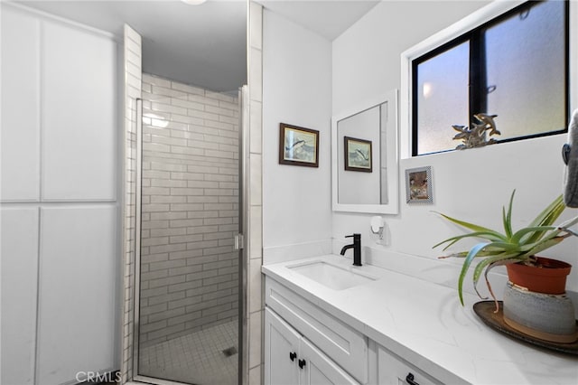 full bathroom featuring vanity and a stall shower
